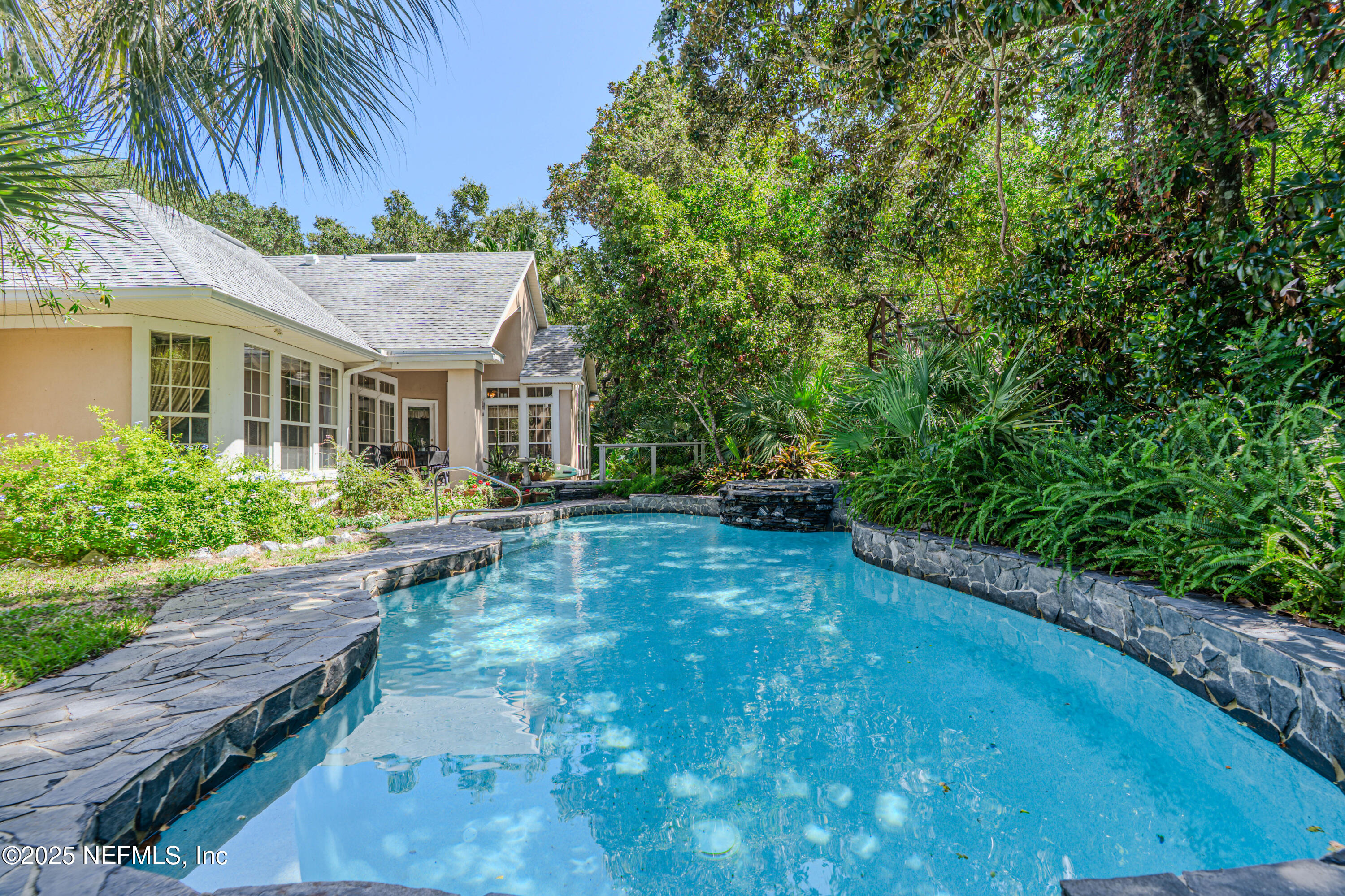 244 Bluebird Lane St. Augustine Beach, FL 32080 - Photo 49 of 66 a view of a house with backyard and sitting area