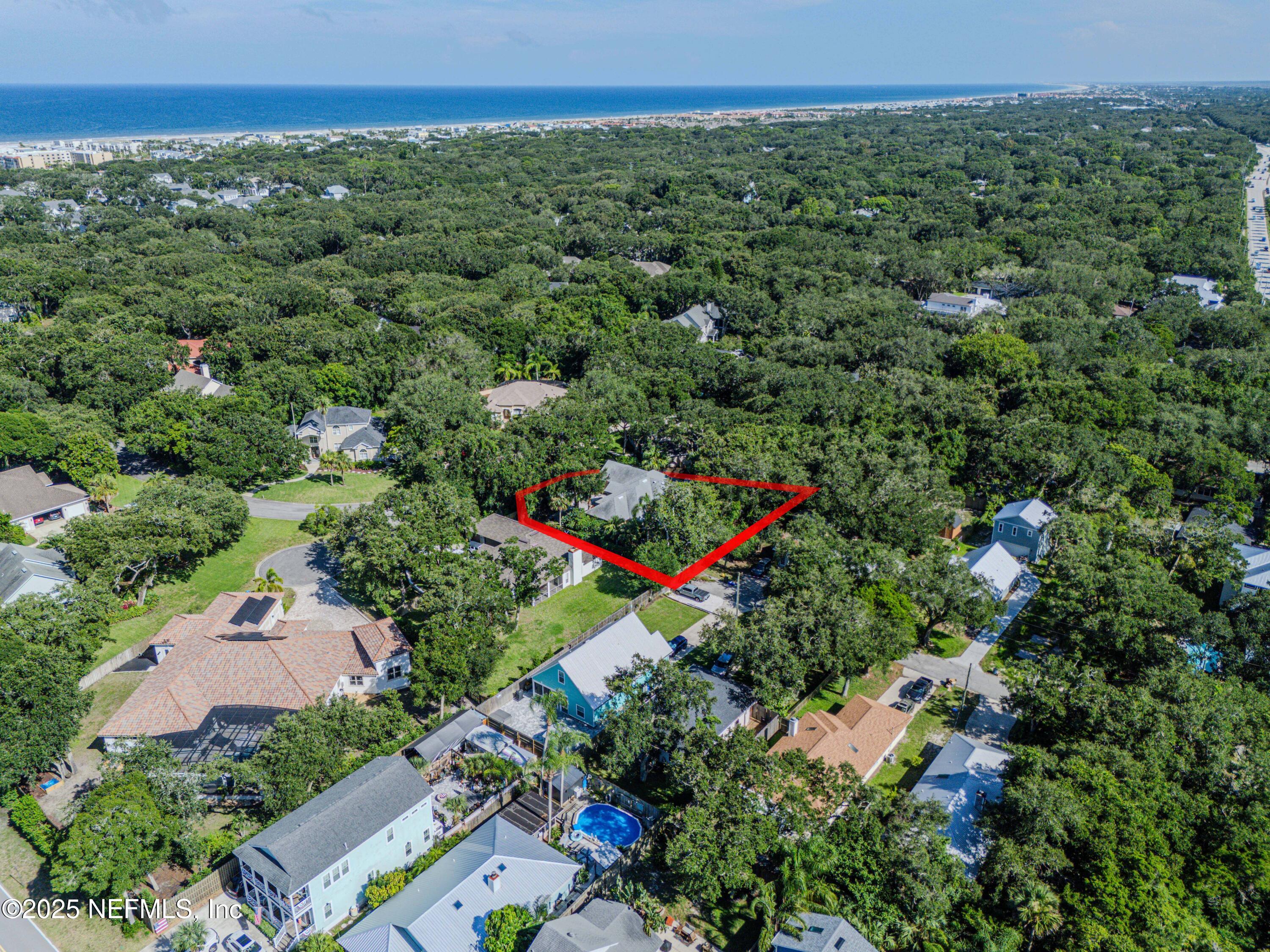 244 Bluebird Lane St. Augustine Beach, FL 32080 - Photo 59 of 66 an aerial view of a house with a yard