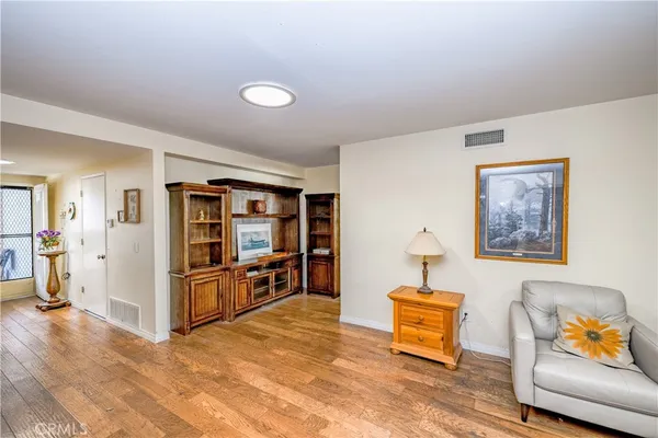 a view of a livingroom with furniture and cabinet