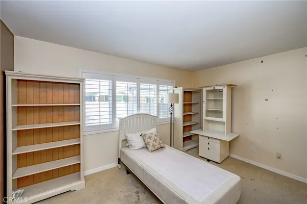 a living room with furniture and closet