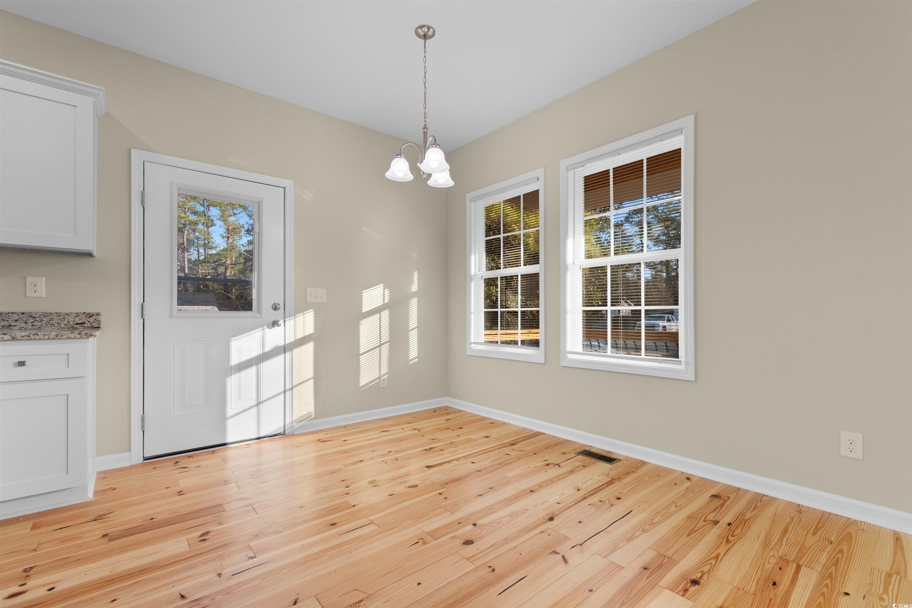 135 Oak Log Lake Road Conway, SC 29526 - Photo 10 of 35 Unfurnished dining area with a chandelier, light w