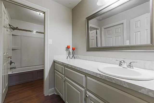 a bathroom with a sink and a mirror