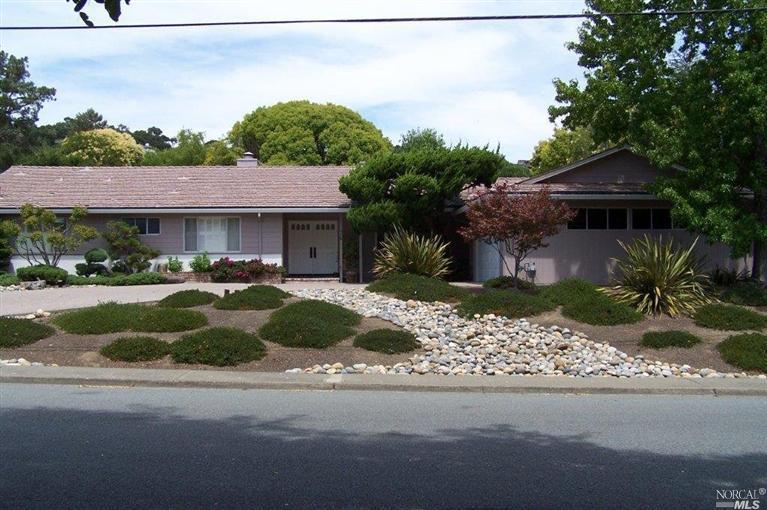 76 Lochinvar Road San Rafael, CA 94901 - Photo 1 of 1 a front view of a house with a yard and potted plants