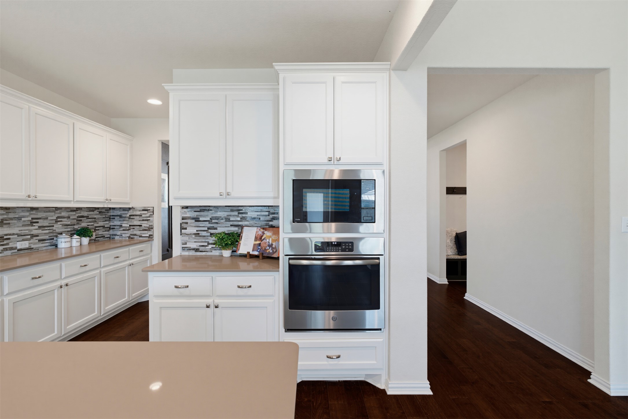 12613 Twisted Root Drive Manchaca, TX 78652 - Photo 6 of 33 A pristine culinary space with rich hardwood floors and sleek, integrated stainless steel appliances.