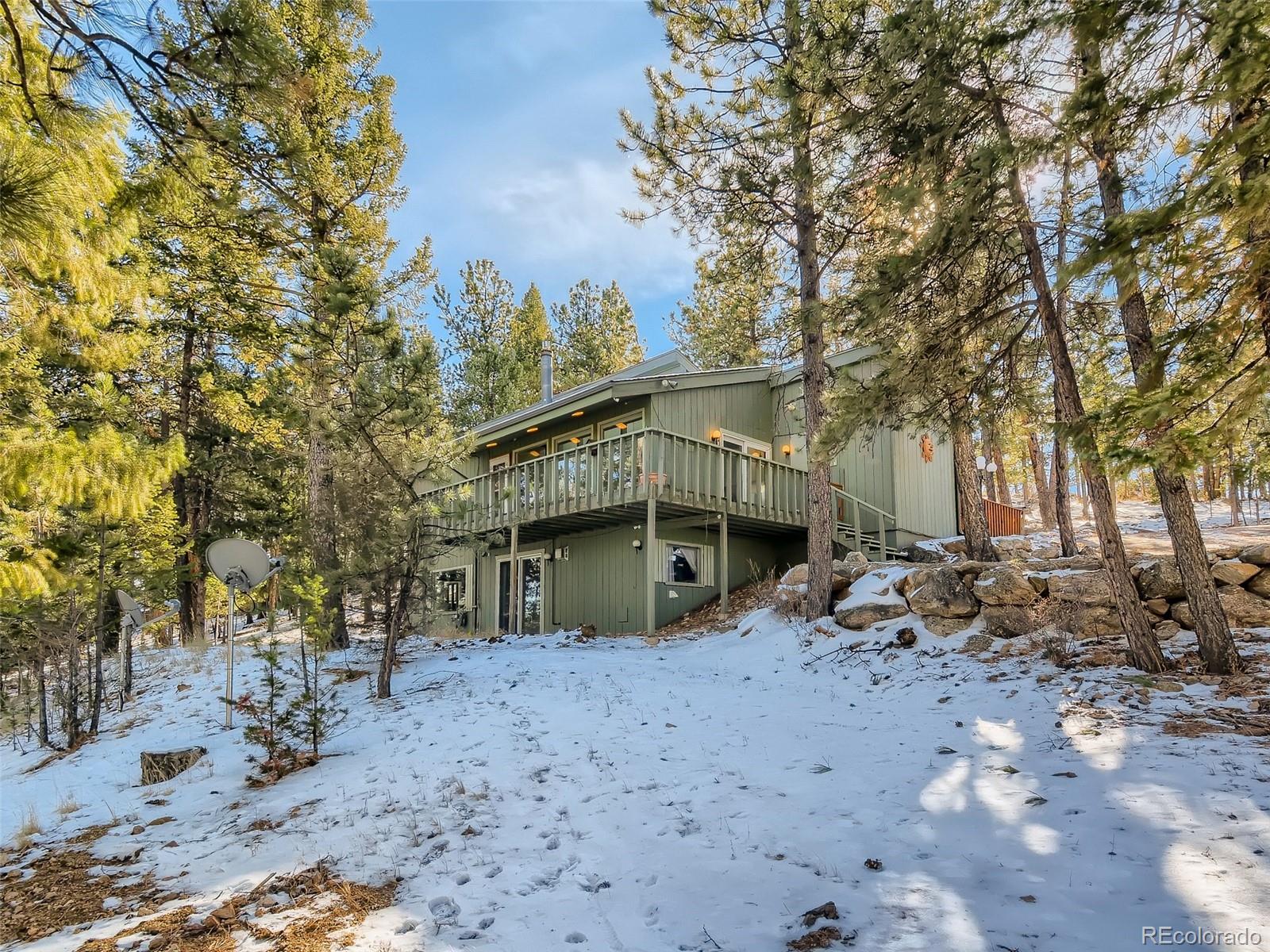 20 Long Ridge Drive Bailey, CO 80421 - Photo 11 of 25 a view of a house with a snow in the yard