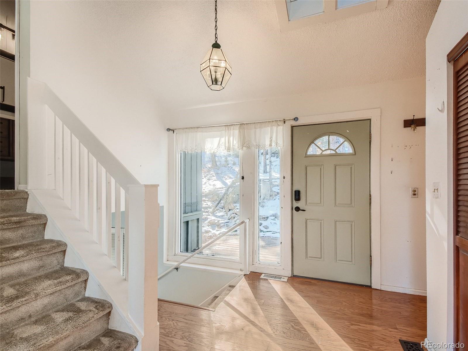 20 Long Ridge Drive Bailey, CO 80421 - Photo 13 of 25 a view of an entryway with wooden floor
