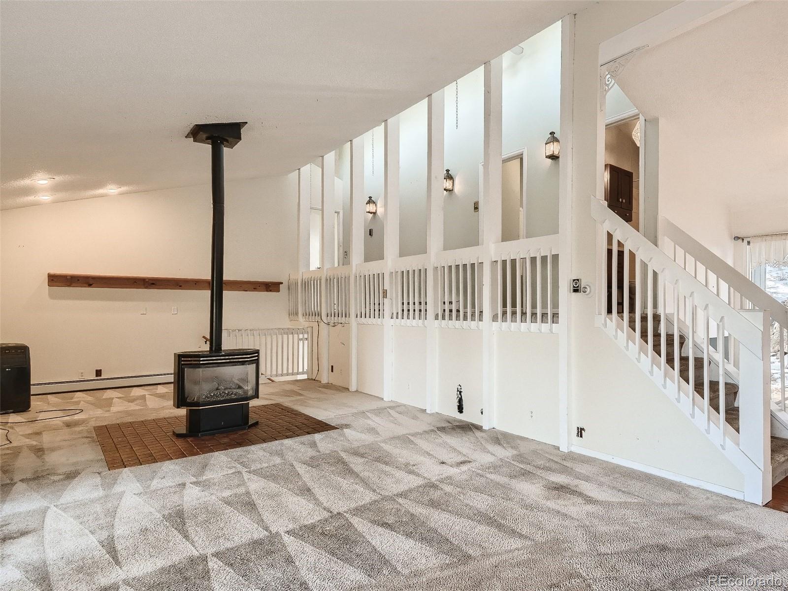 20 Long Ridge Drive Bailey, CO 80421 - Photo 15 of 25 a view of a bedroom with wooden floor and chair