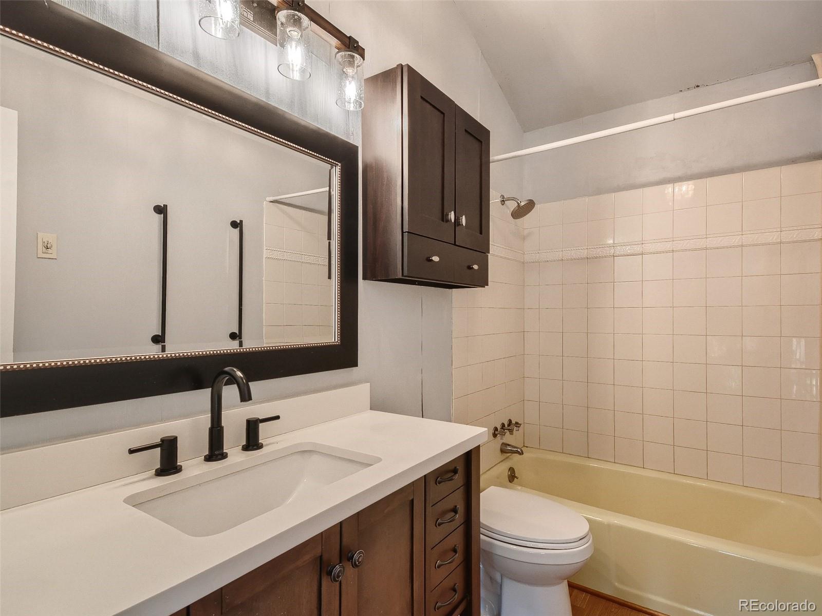 20 Long Ridge Drive Bailey, CO 80421 - Photo 21 of 25 a bathroom with a sink a toilet and a mirror