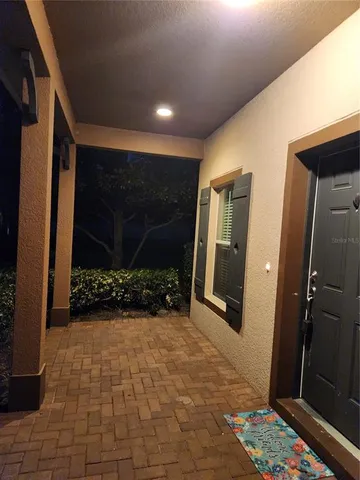 a view of a entryway door with wooden floor