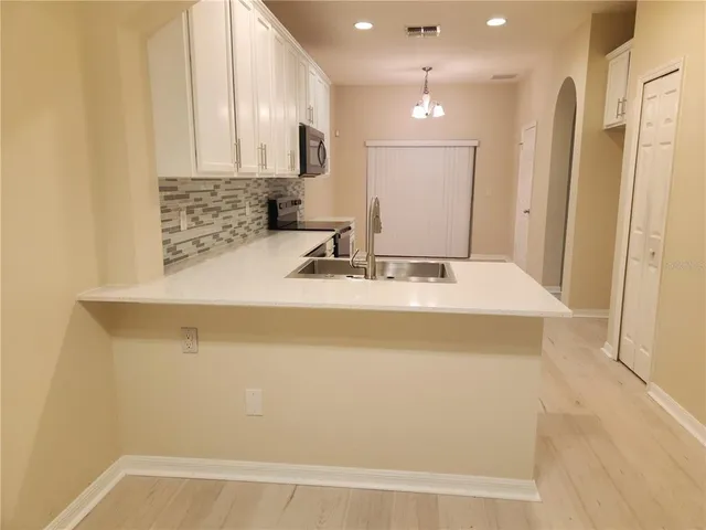 a bathroom with a sink a mirror and a shower