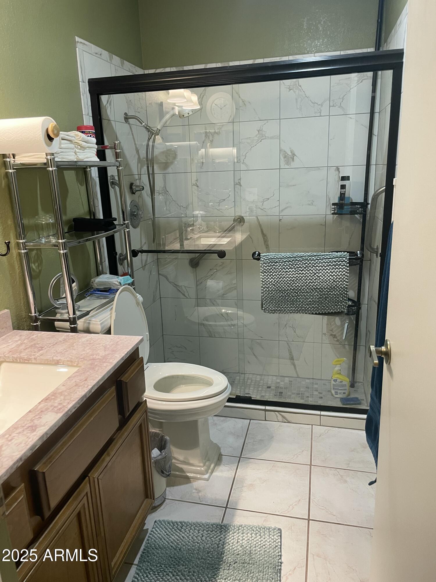 1022 East Wagoner Road Phoenix, AZ 85022 - Photo 11 of 13 a bathroom with a granite countertop sink a toilet and shower