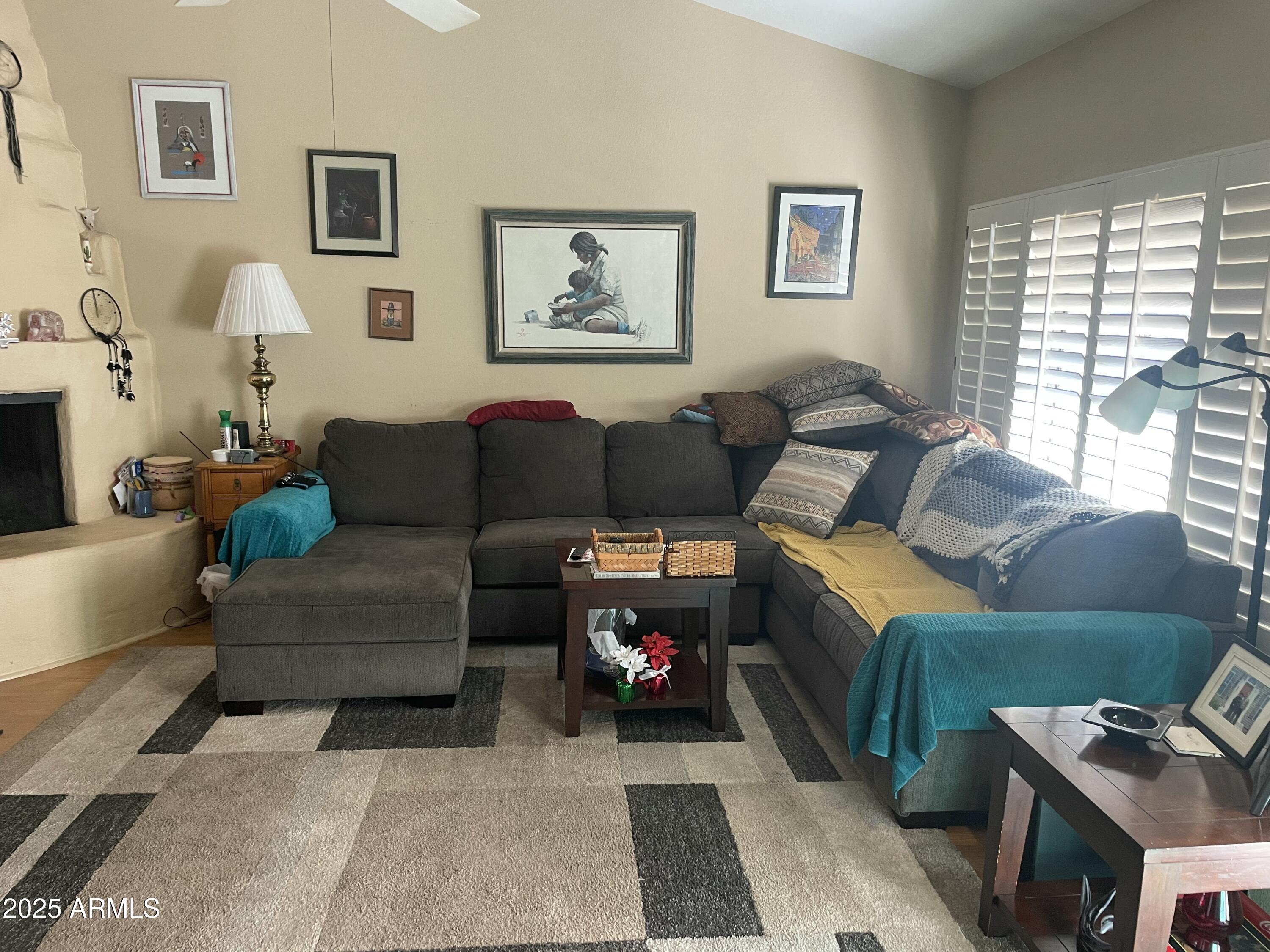 1022 East Wagoner Road Phoenix, AZ 85022 - Photo 2 of 13 a living room with furniture and a window