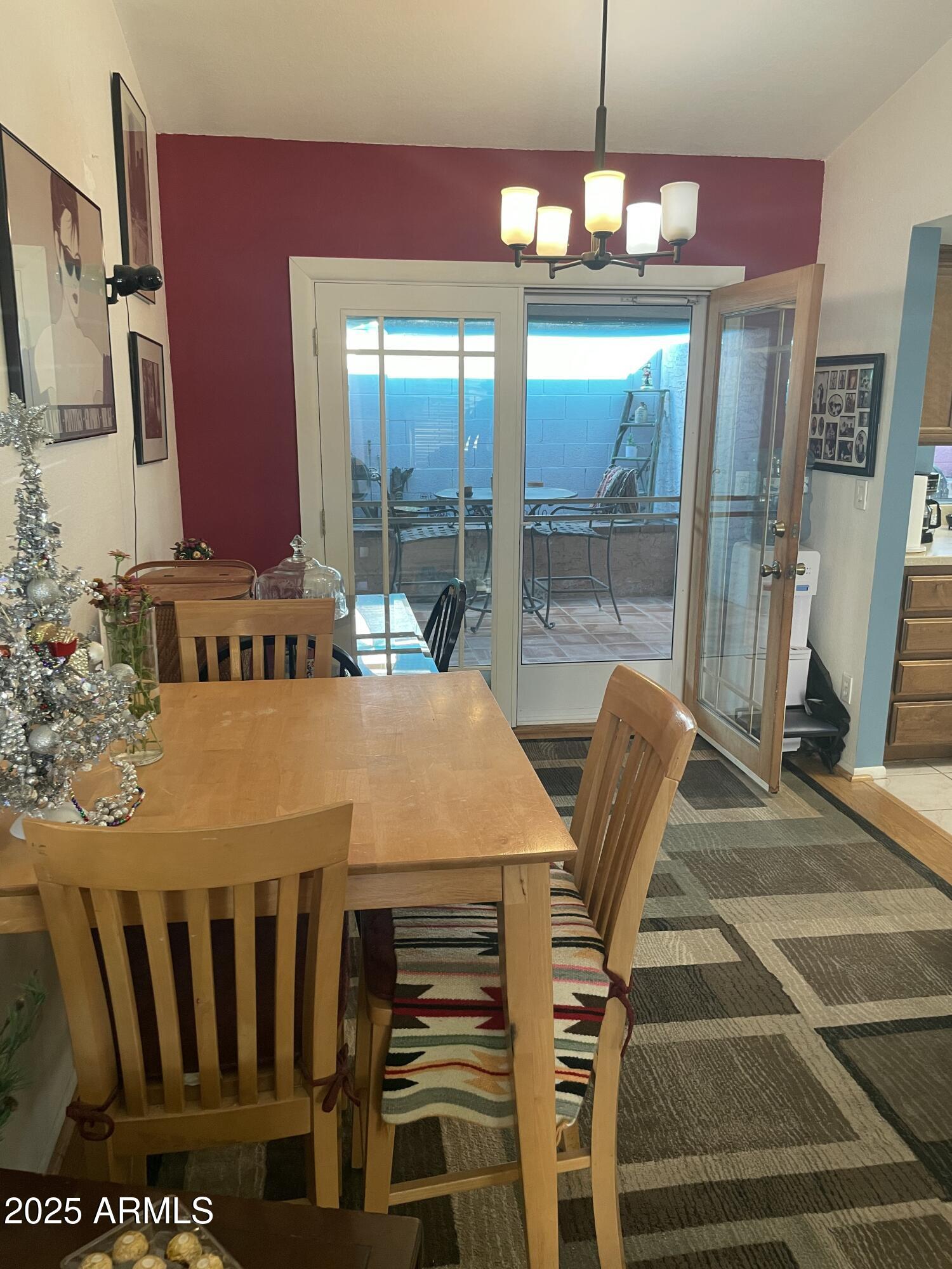 1022 East Wagoner Road Phoenix, AZ 85022 - Photo 3 of 13 a dining room with a table and chairs
