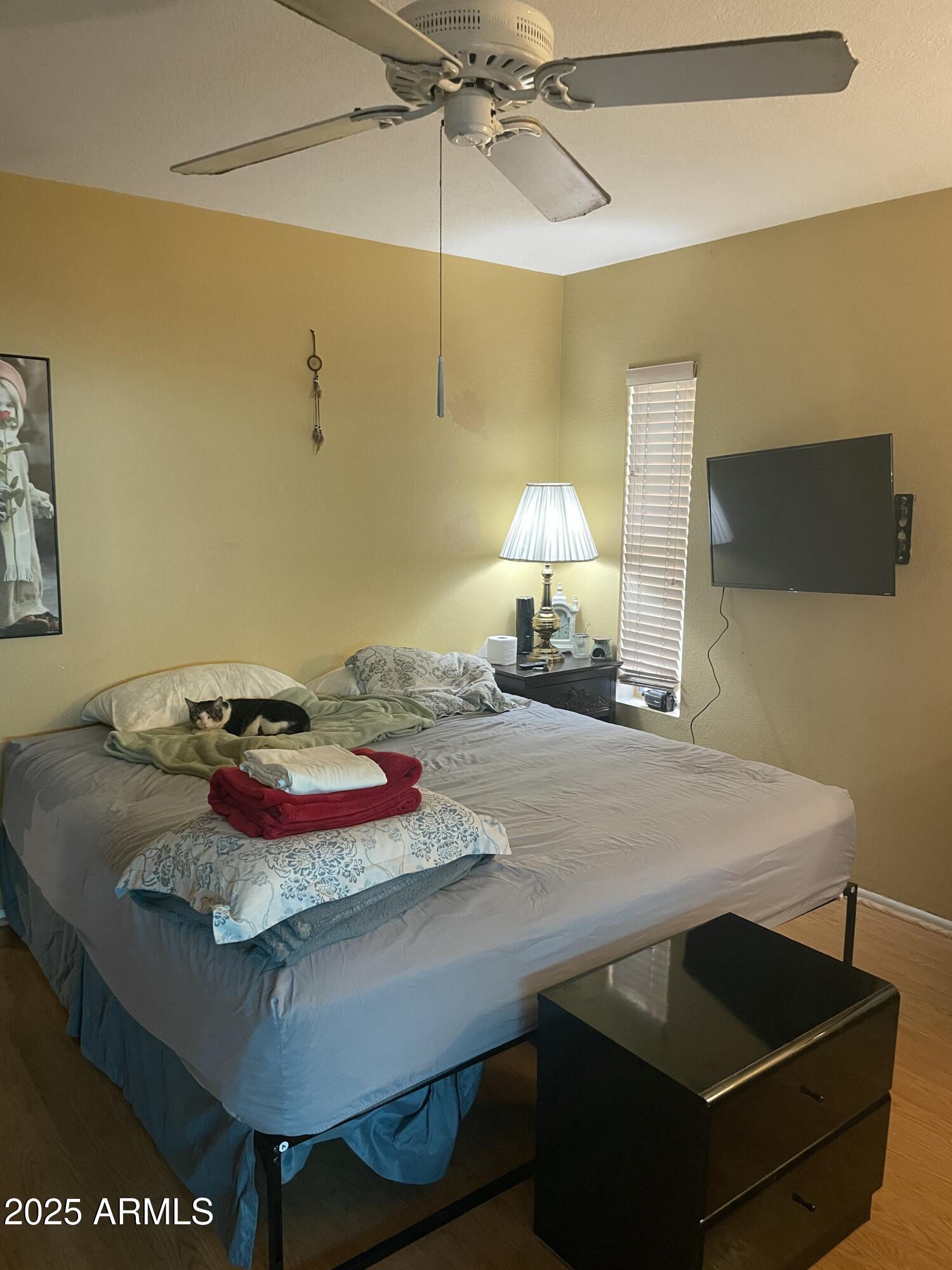 1022 East Wagoner Road Phoenix, AZ 85022 - Photo 5 of 13 a bedroom with a bed and a table