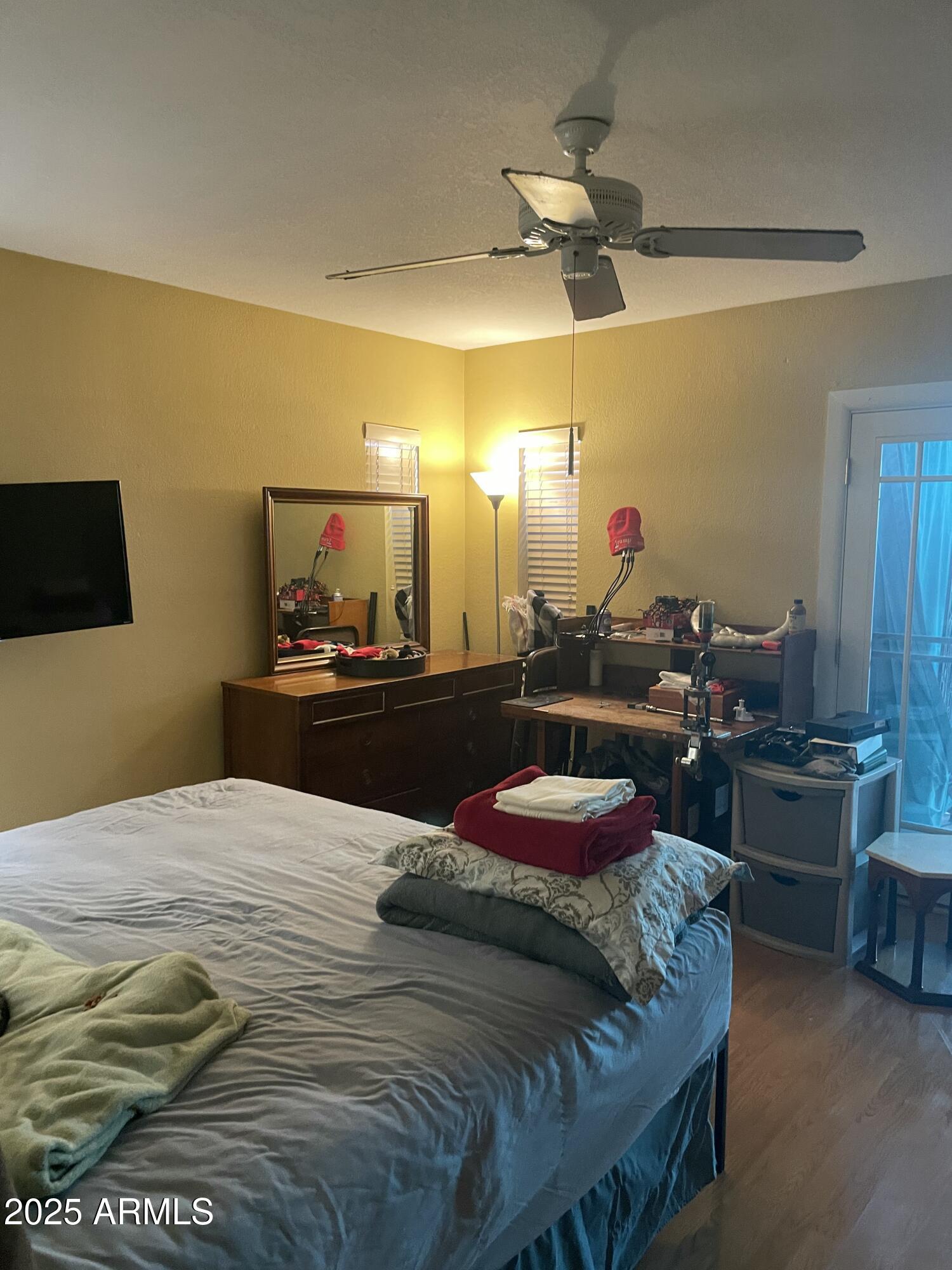 1022 East Wagoner Road Phoenix, AZ 85022 - Photo 6 of 13 a bedroom with a bed and a chandelier