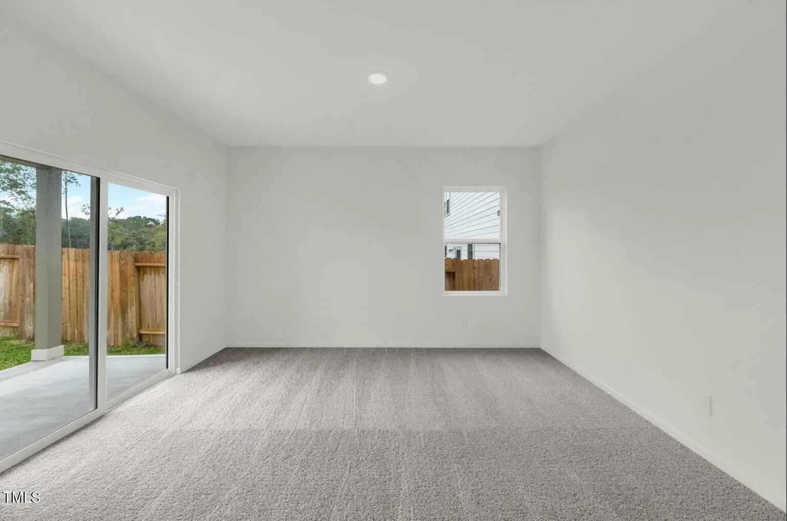 207 Bedstone Way Clayton, NC 27520 - Photo 5 of 20 an empty room with windows