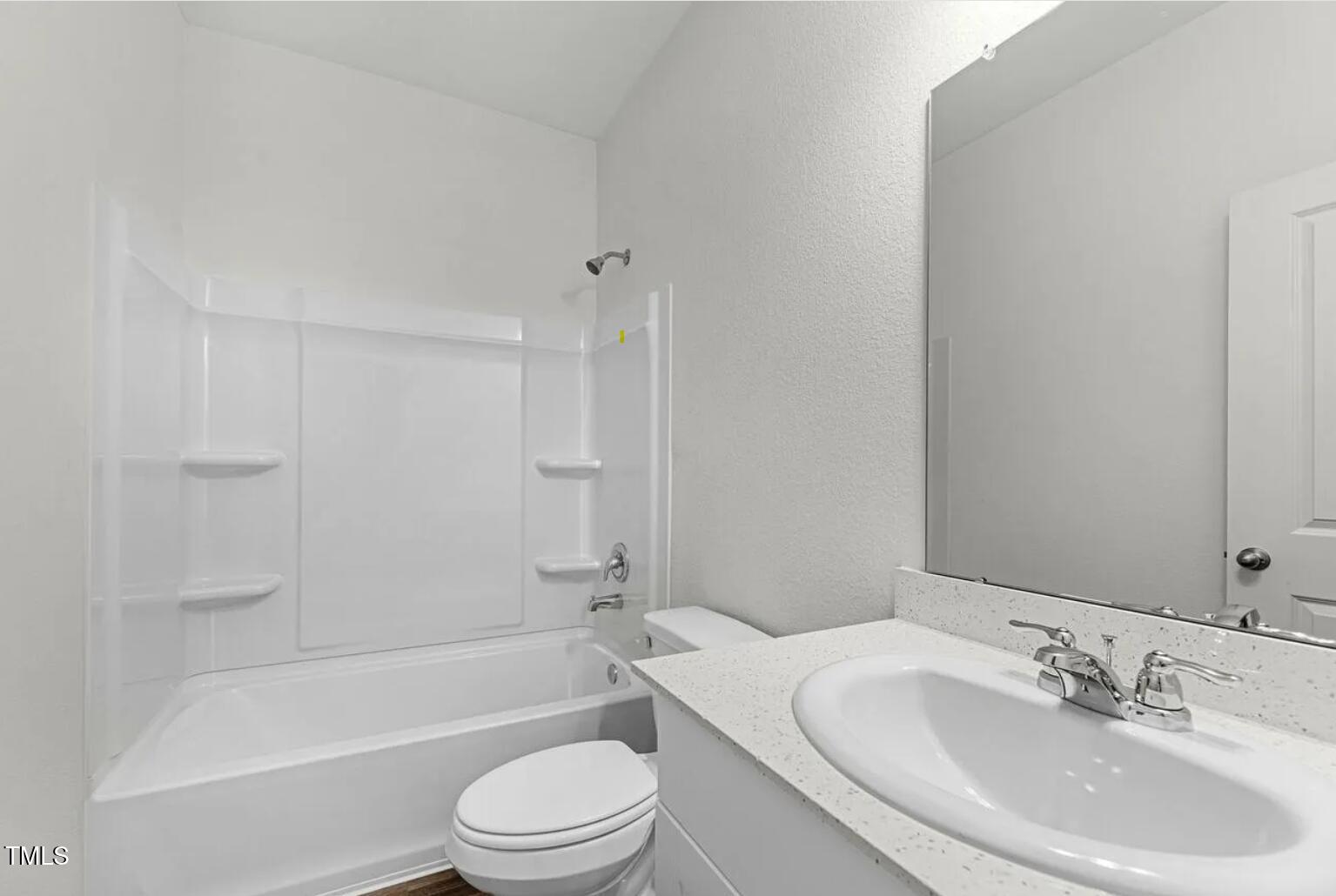 207 Bedstone Way Clayton, NC 27520 - Photo 9 of 20 a bathroom with a toilet a sink and bathtub