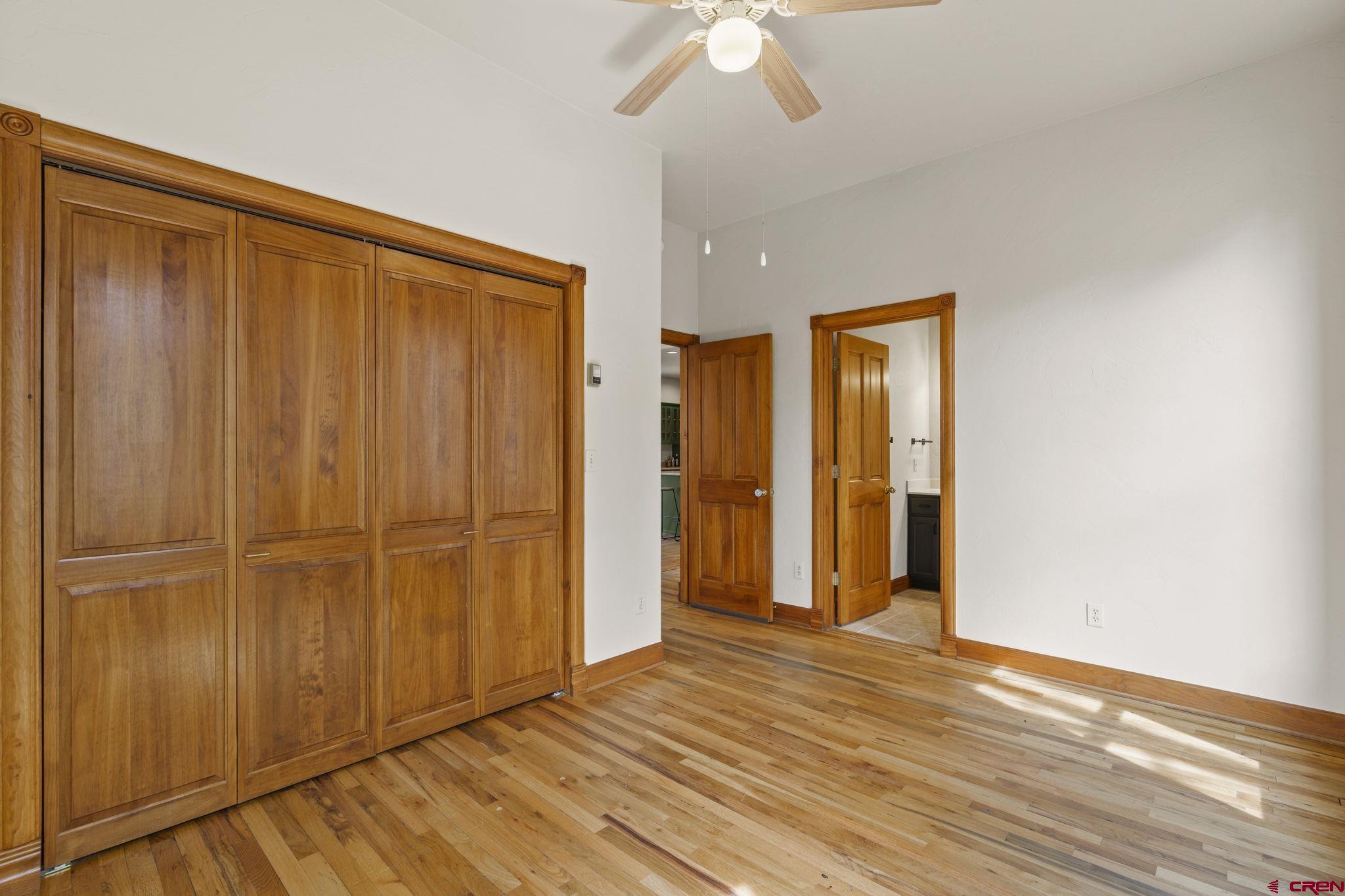 1330 East 3rd Avenue Durango, CO 81301 - Photo 18 of 32 a view of an empty room with wooden floor