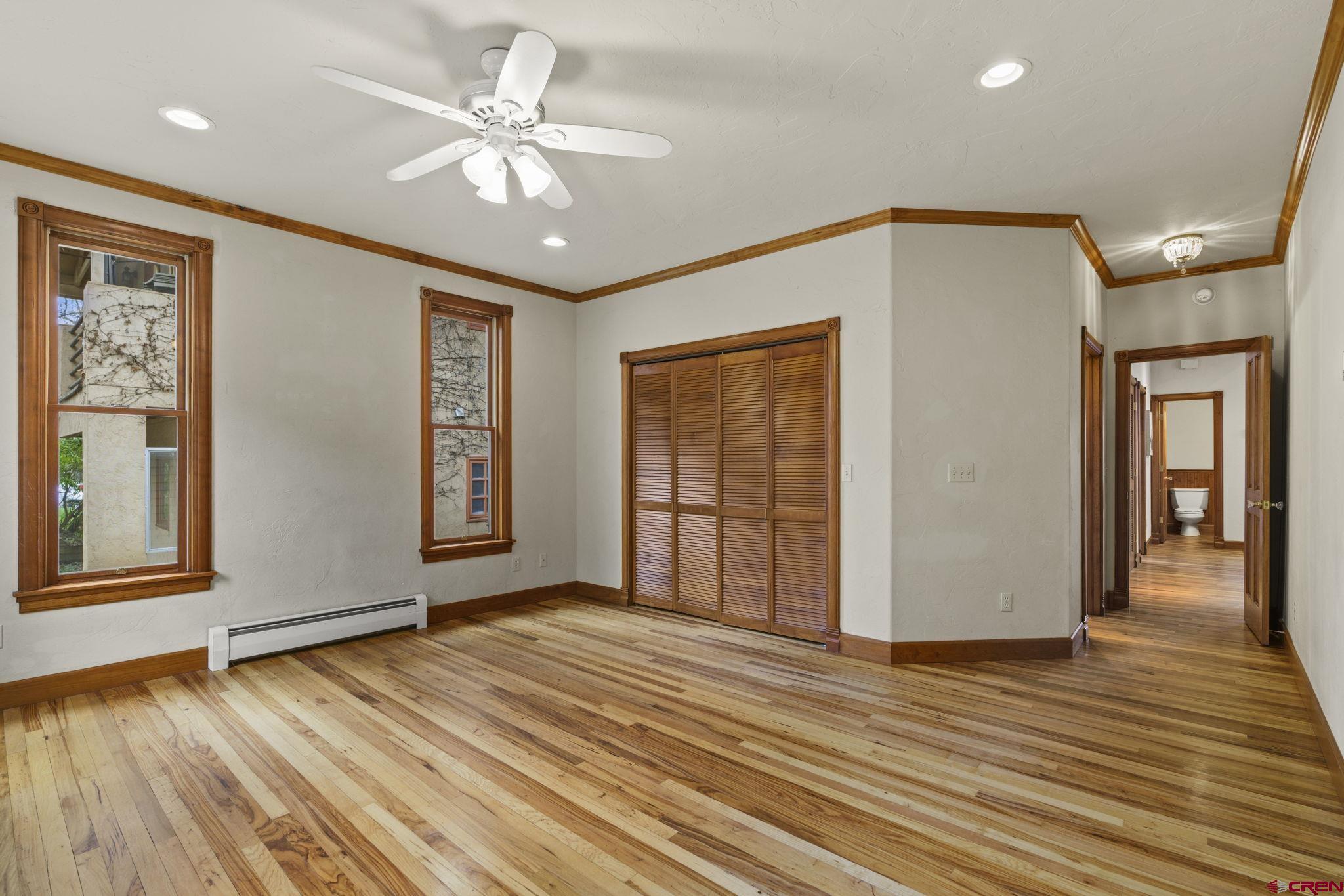 1330 East 3rd Avenue Durango, CO 81301 - Photo 21 of 32 a view of a livingroom with wooden floor and a ceiling fan
