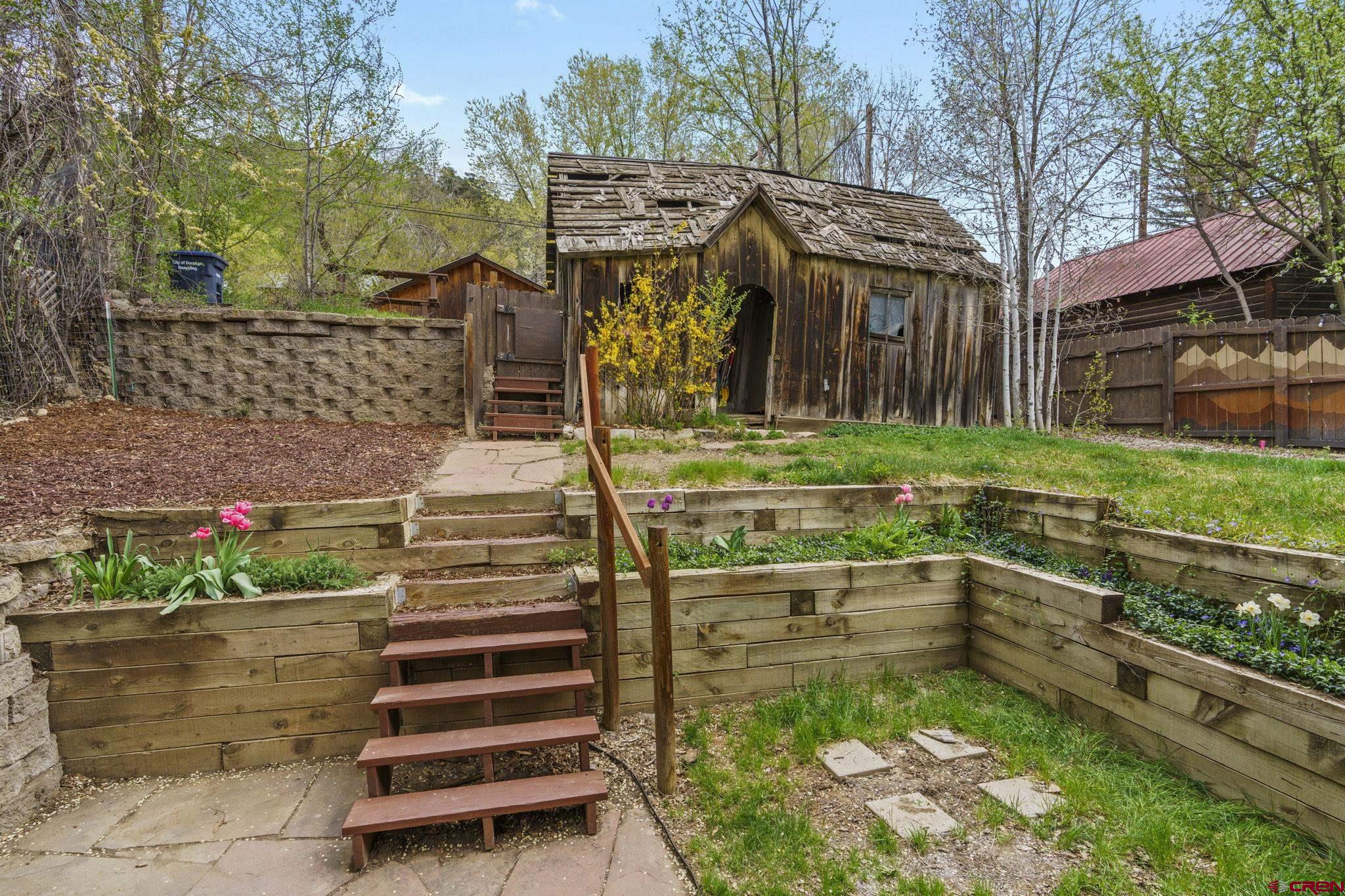 1330 East 3rd Avenue Durango, CO 81301 - Photo 28 of 32 a front view of a house with a yard