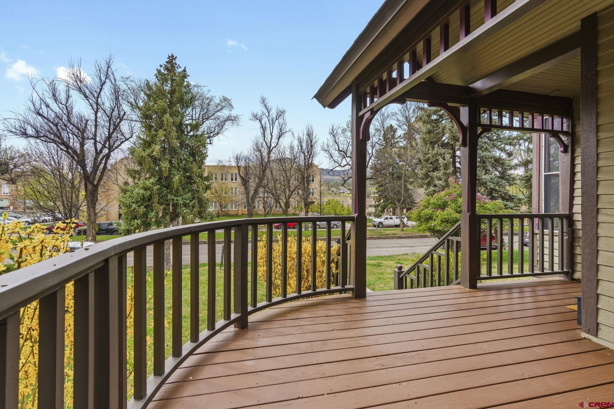 1330 East 3rd Avenue Durango, CO 81301 - Photo 3 of 32 a view of a balcony with wooden floor and fence
