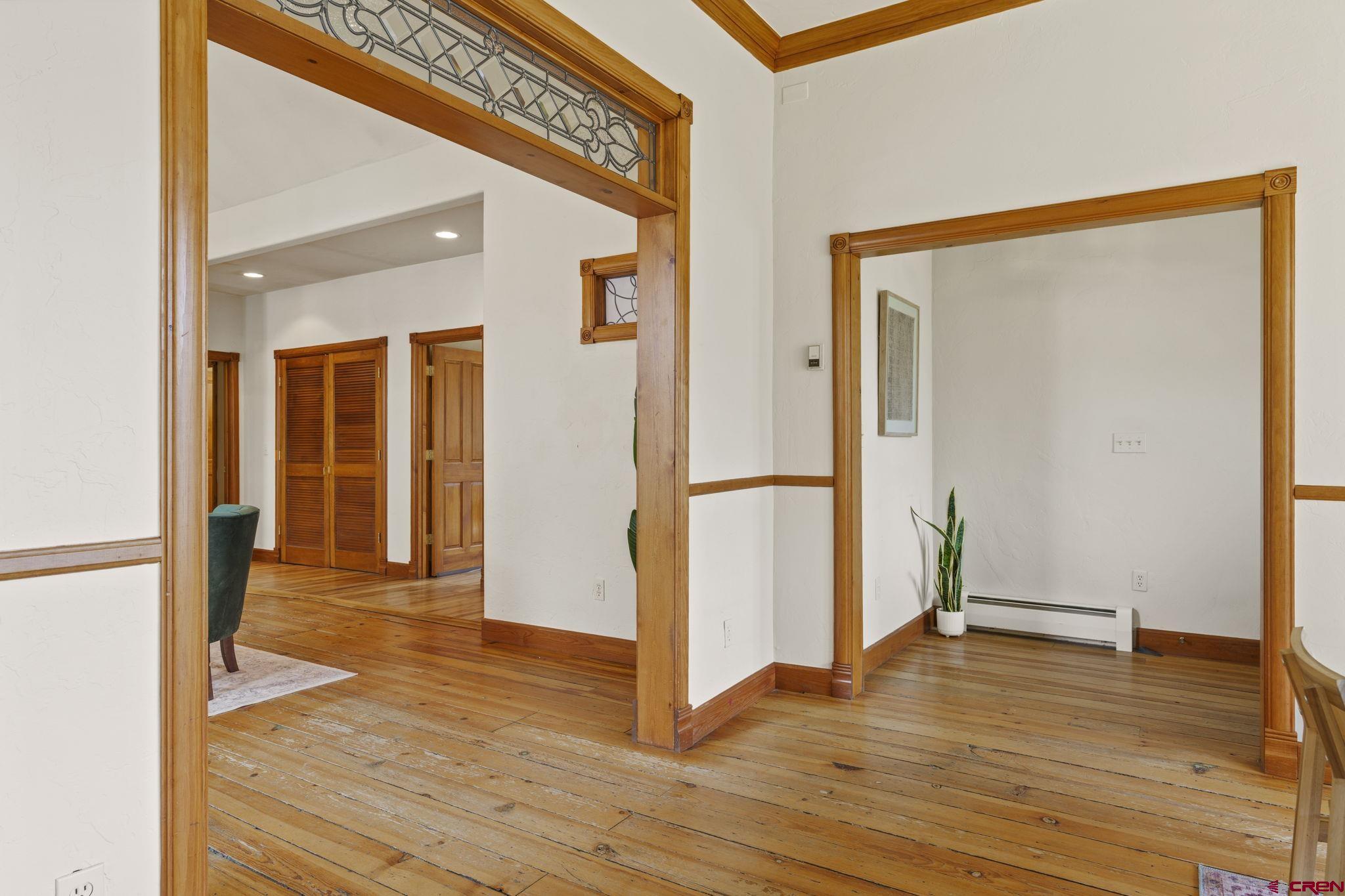 1330 East 3rd Avenue Durango, CO 81301 - Photo 4 of 32 a view of a hallway with wooden floor and closet