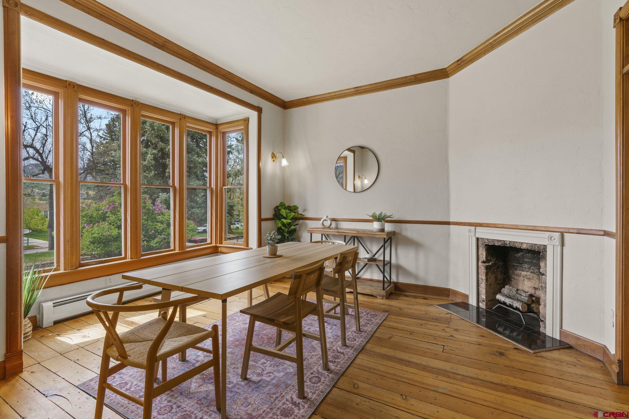 1330 East 3rd Avenue Durango, CO 81301 - Photo 5 of 32 a view of a dining room with furniture and wooden floor