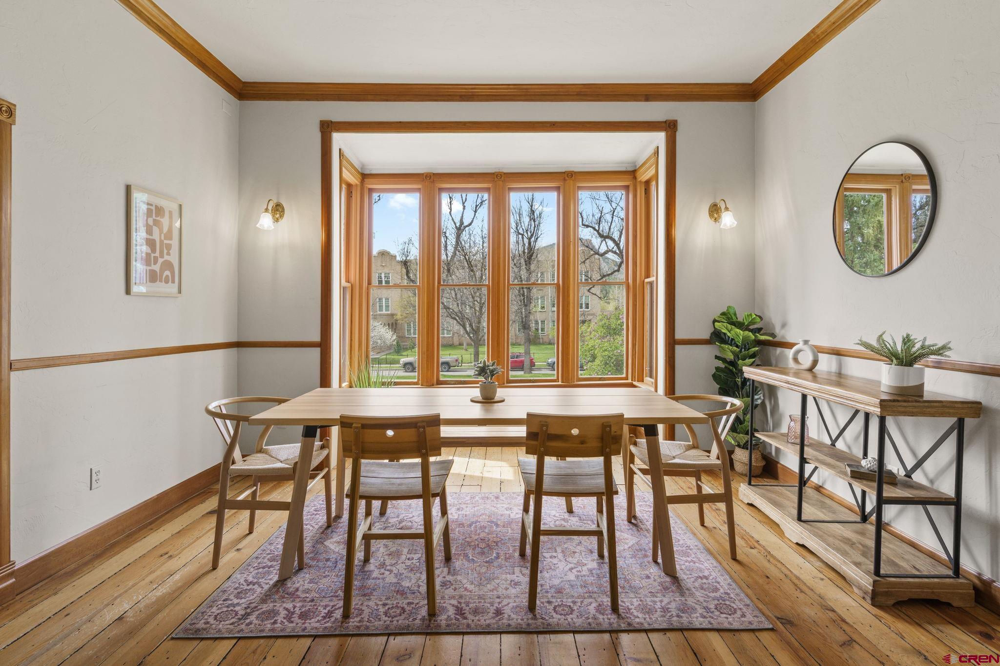 1330 East 3rd Avenue Durango, CO 81301 - Photo 6 of 32 a view of a dining room with furniture window and wooden floor