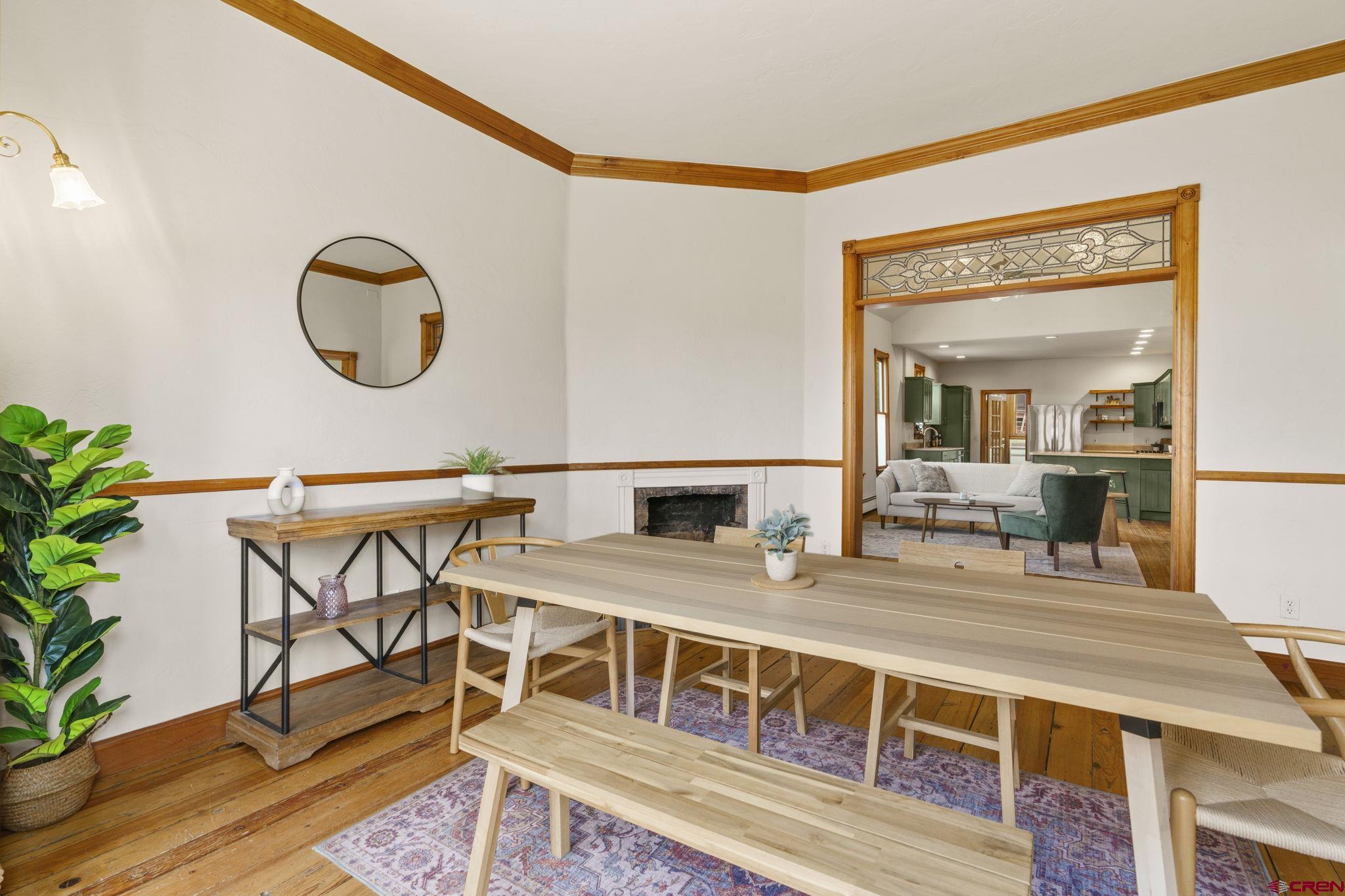 1330 East 3rd Avenue Durango, CO 81301 - Photo 7 of 32 a living room with chairs a table and chairs