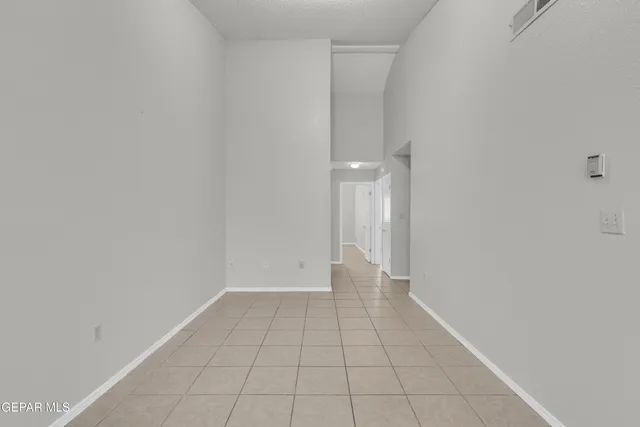 a kitchen with a sink cabinets and a window
