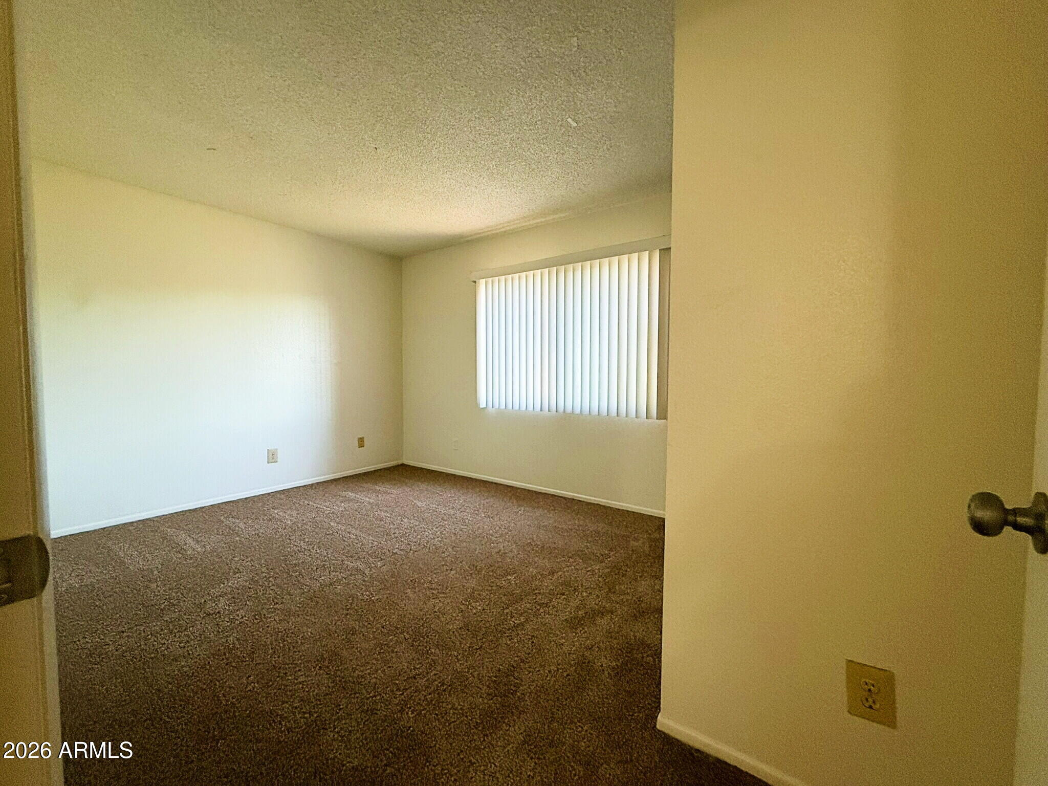 5208 West Calavar Road Glendale, AZ 85306 - Photo 20 of 39 an empty room with windows