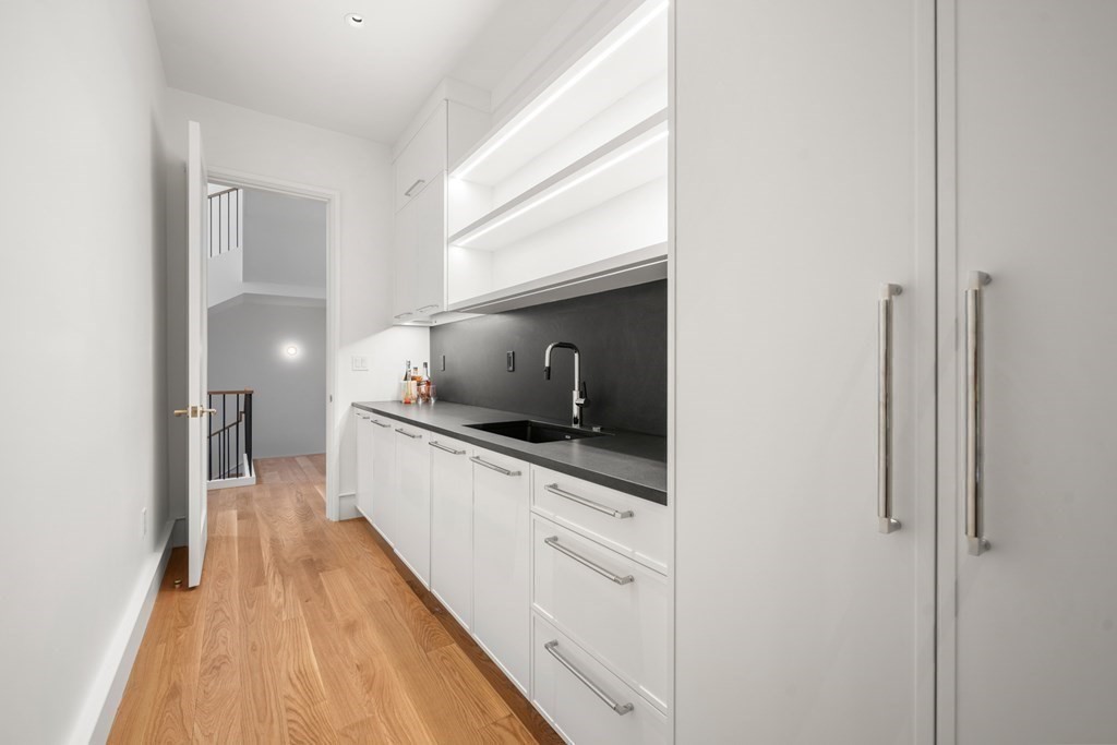 78 Arnold Road Wellesley, MA 02481 - Photo 13 of 42 a kitchen with granite countertop a sink and a stove top oven