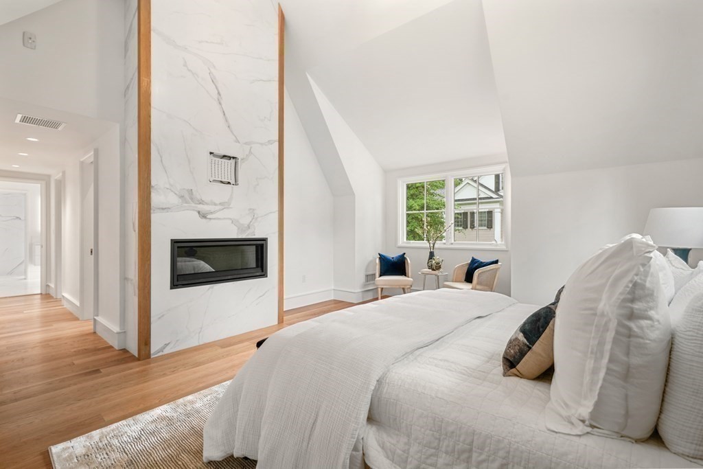 78 Arnold Road Wellesley, MA 02481 - Photo 22 of 42 a bedroom with a bed and a fireplace