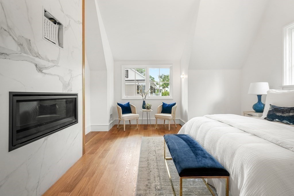 78 Arnold Road Wellesley, MA 02481 - Photo 23 of 42 a living room with furniture and a fireplace