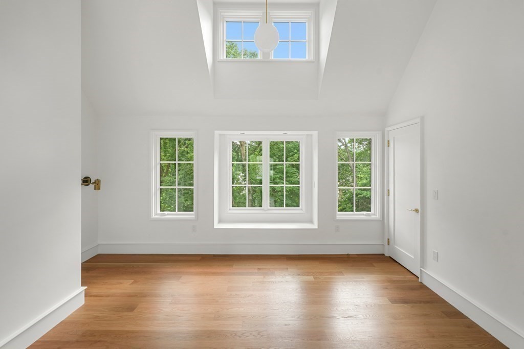 78 Arnold Road Wellesley, MA 02481 - Photo 26 of 42 an empty room with wooden floor and windows