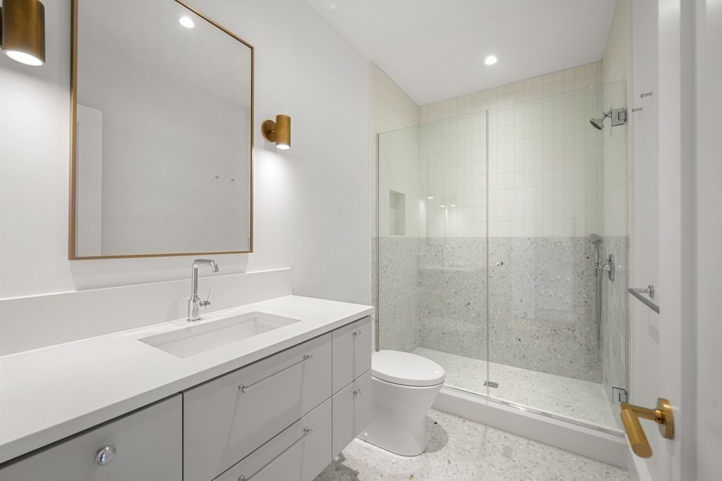 78 Arnold Road Wellesley, MA 02481 - Photo 27 of 42 a bathroom with a sink a toilet and shower