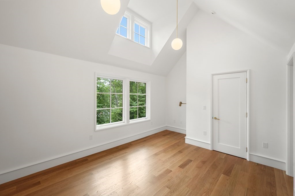 78 Arnold Road Wellesley, MA 02481 - Photo 28 of 42 a view of an empty room with wooden floor and a window