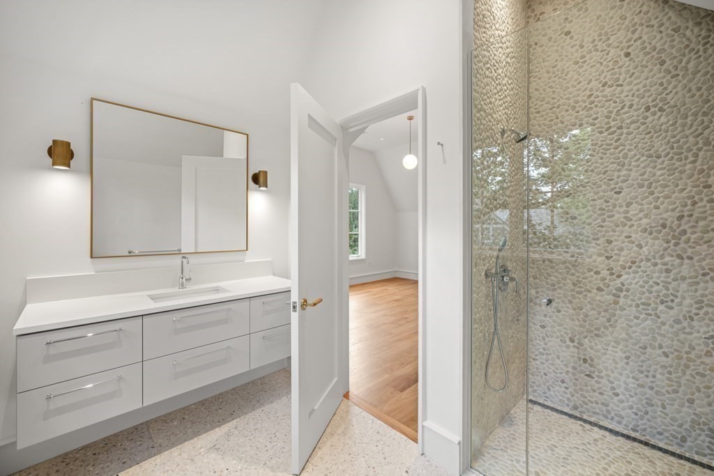 78 Arnold Road Wellesley, MA 02481 - Photo 29 of 42 a bathroom with a shower sink and mirror