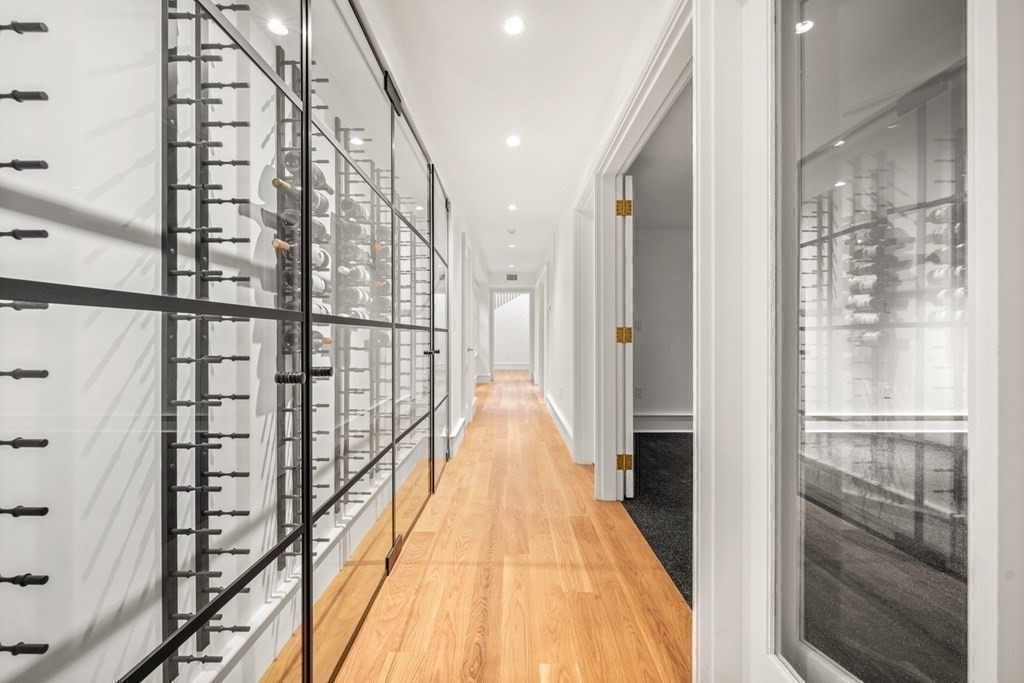 78 Arnold Road Wellesley, MA 02481 - Photo 30 of 42 a view of a hallway with wooden floor and staircase