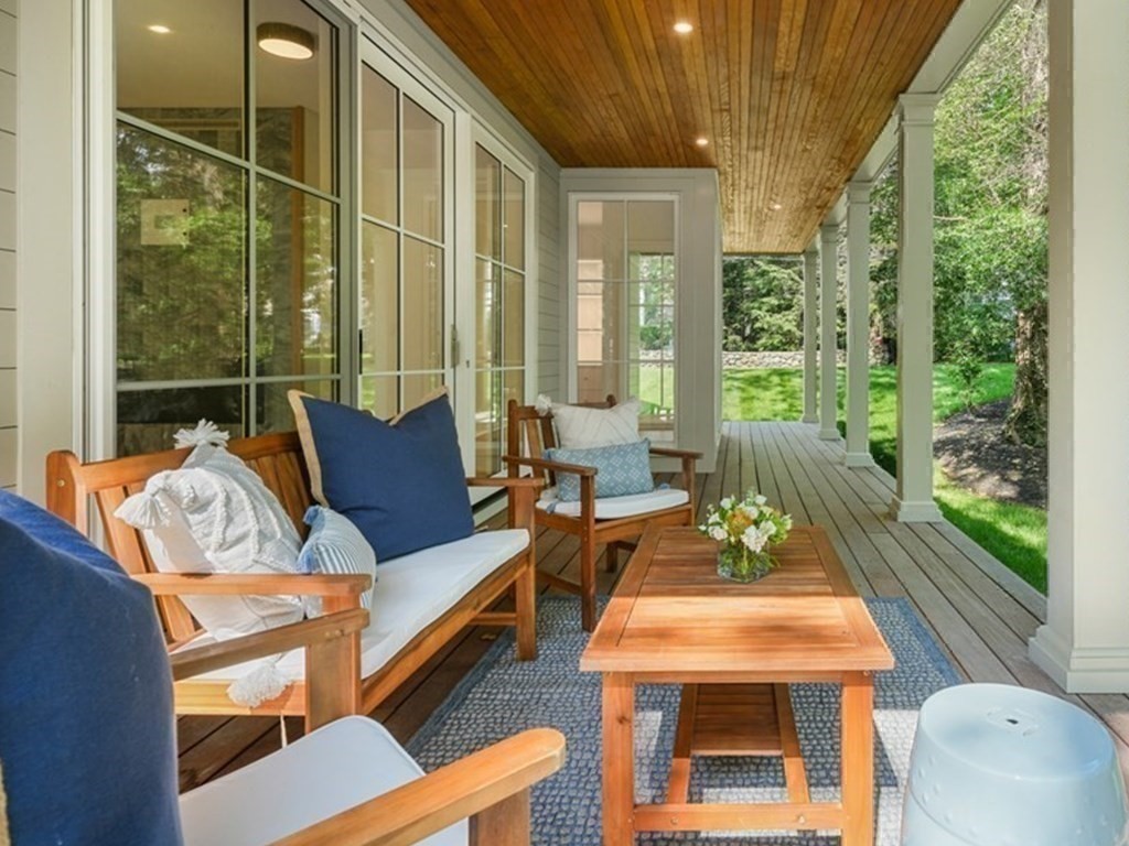 78 Arnold Road Wellesley, MA 02481 - Photo 35 of 42 a outdoor space with patio the couches and a dining table with garden view