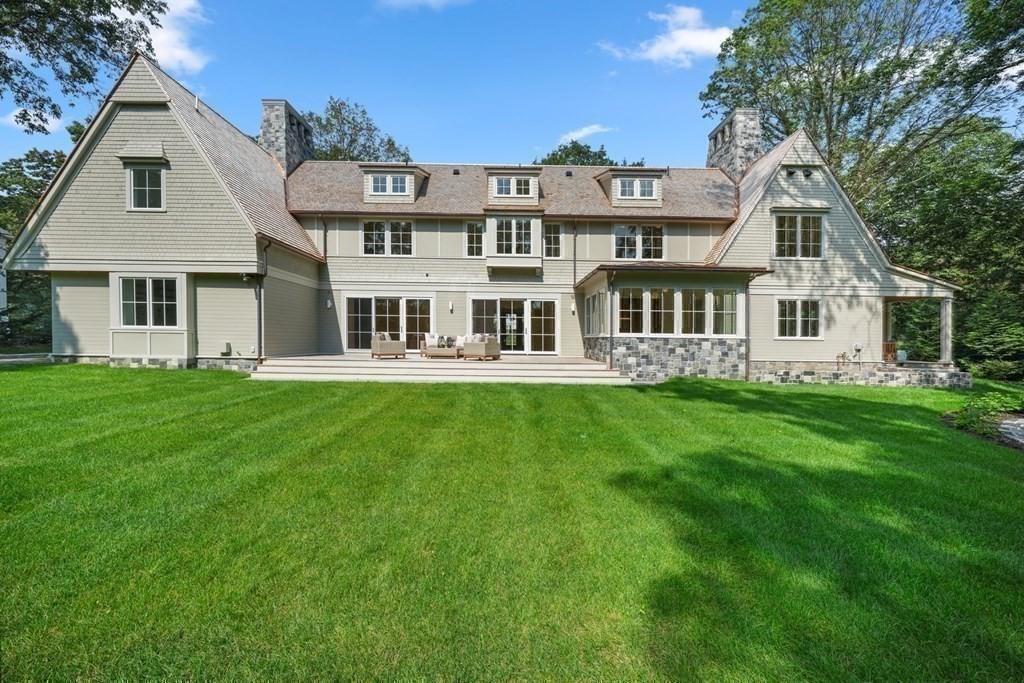 78 Arnold Road Wellesley, MA 02481 - Photo 38 of 42 a front view of a house with garden and trees
