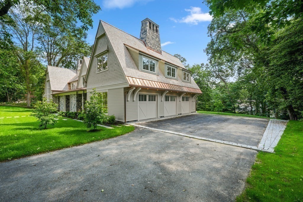 78 Arnold Road Wellesley, MA 02481 - Photo 40 of 42 a front view of a house with a yard and garage