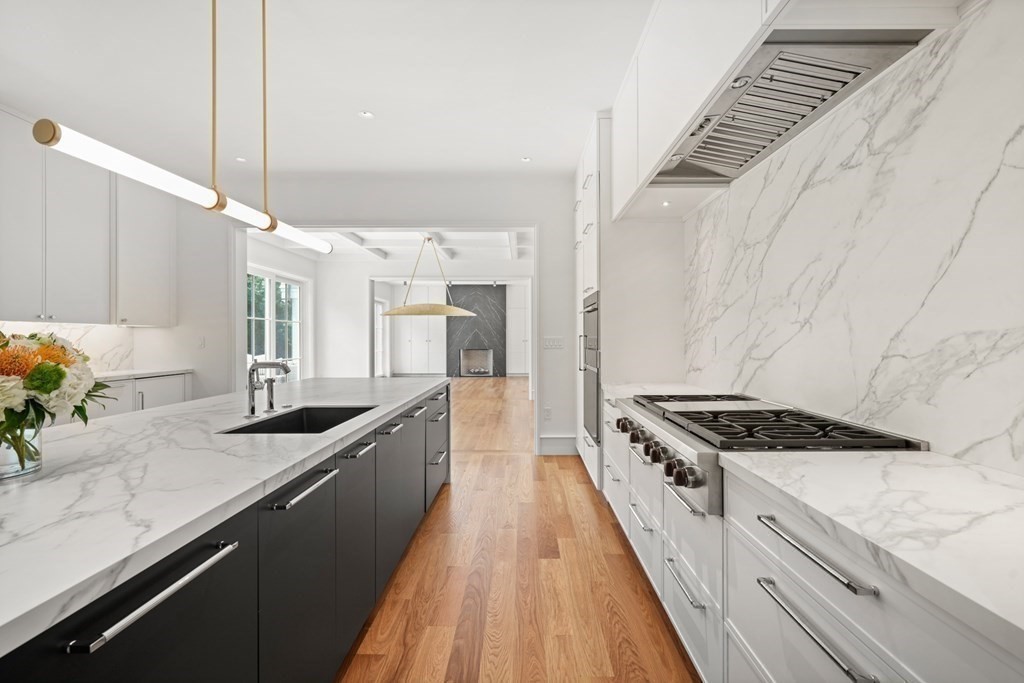 78 Arnold Road Wellesley, MA 02481 - Photo 7 of 42 a kitchen with granite countertop a sink stove and cabinets