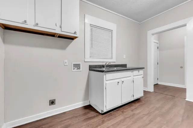 a view of cabinets and wooden floor