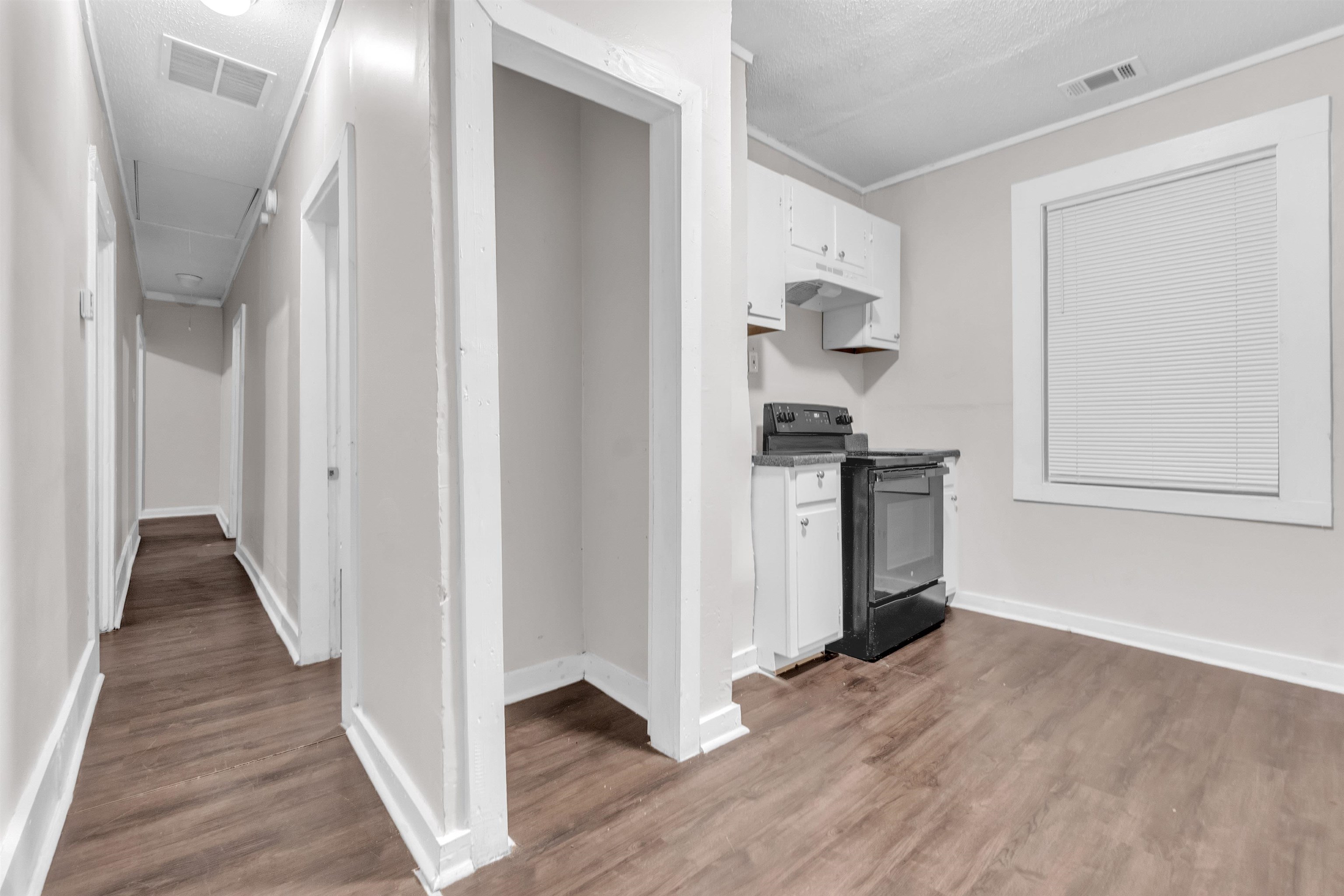 689 Baltimore Street Memphis, TN 38114 - Photo 4 of 14 a view of hallway with wooden floor