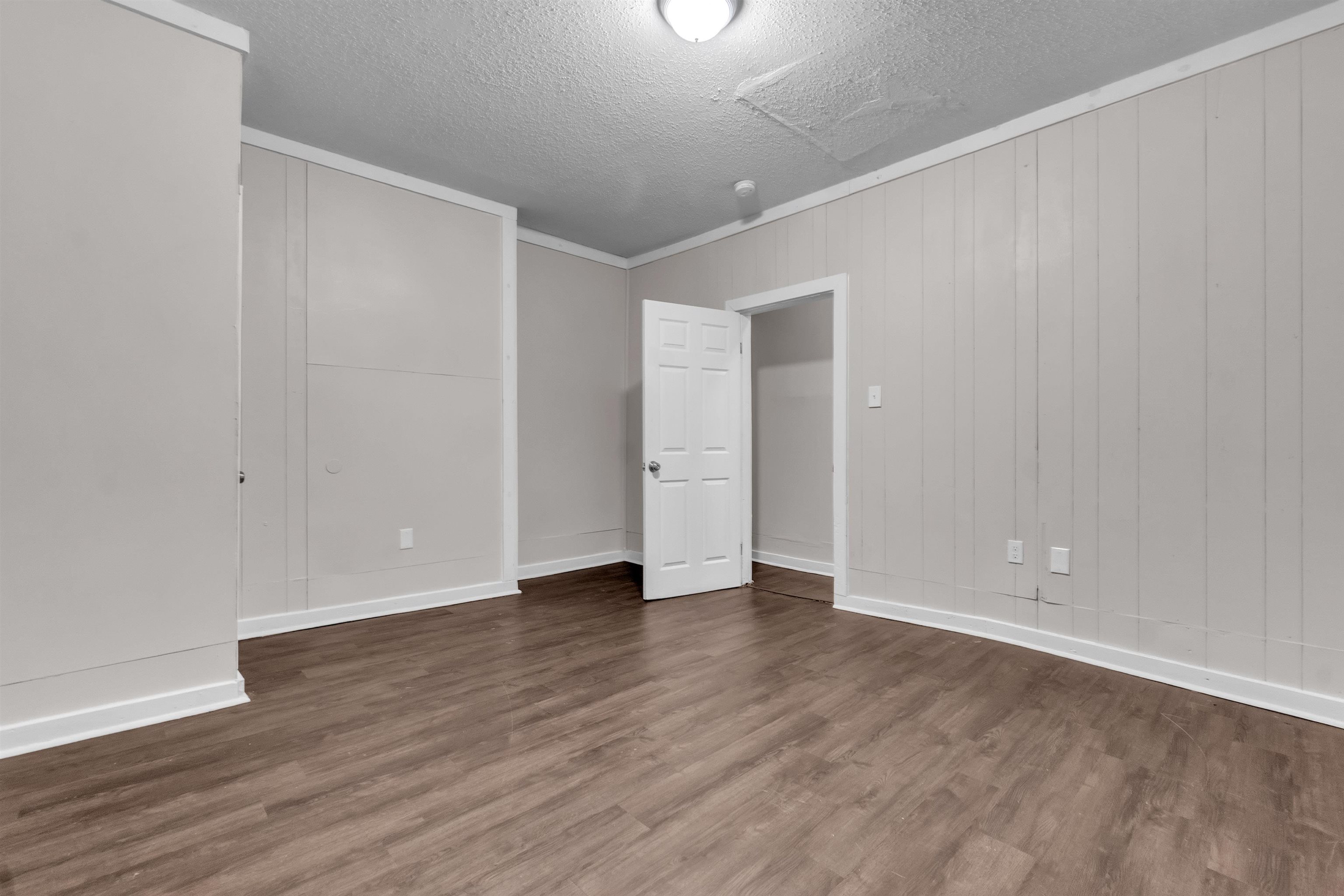 689 Baltimore Street Memphis, TN 38114 - Photo 6 of 14 a view of an empty room with wooden floor