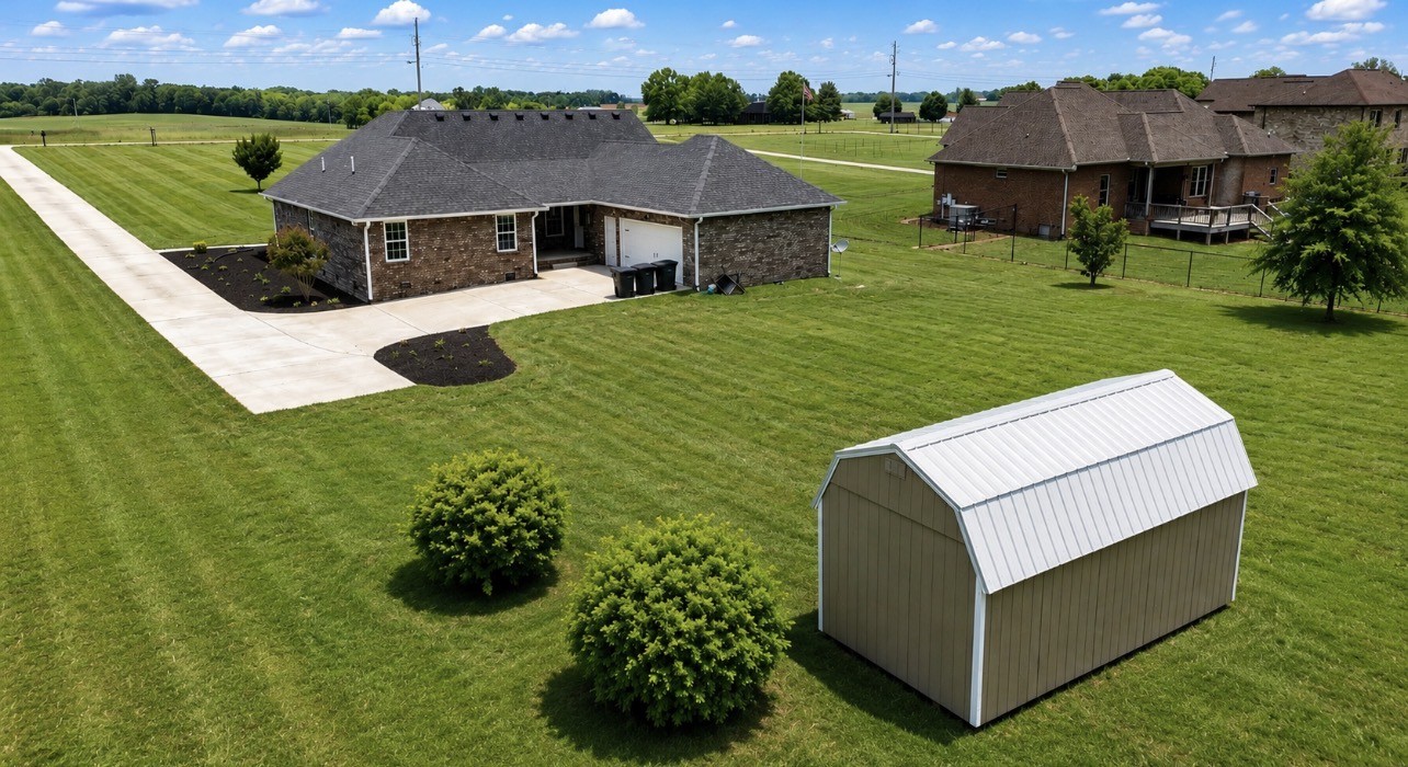 663 Jackson Road Portland, TN 37148 - Photo 5 of 32 a view of a house with a big yard potted plants and large tree