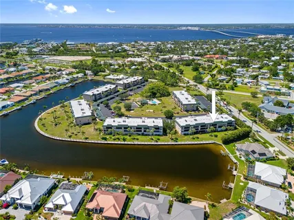 an aerial view of residential houses with outdoor space