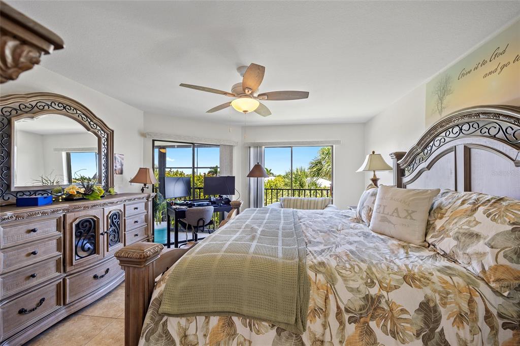 601 Shreve Street, Unit 53C Punta Gorda, FL 33950 - Photo 12 of 30 a bedroom with a bed and ceiling fan