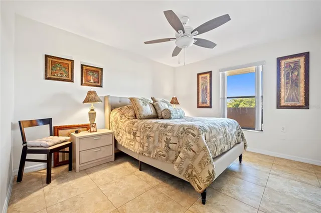 a bed room with a bed and a chair